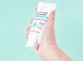 Cleanser tube held in hand