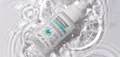 Ampoule serum photographed with water