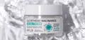 Facial cream jar photographed with water