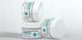 Facial cream jars arranged in a product photograph