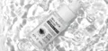 Snail mucin ginseng serum photographed with water